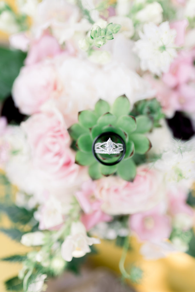 A close up shot of a ring in a lush green and blush bouquet for a romantic garden wedding in Nashville