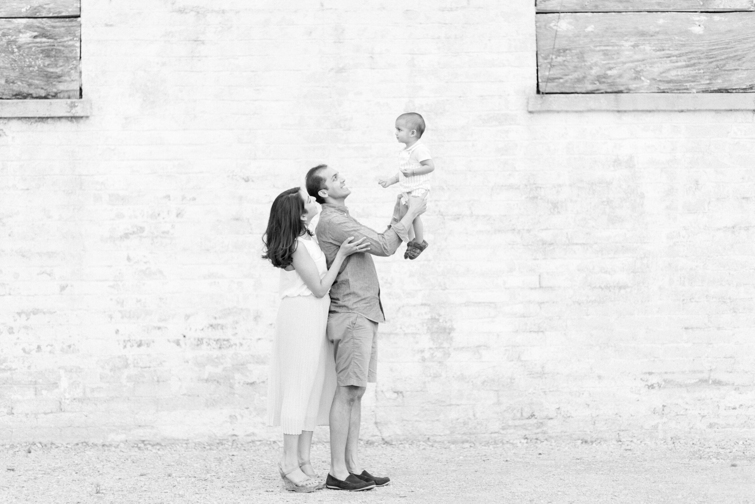 black and white photo of Family portrait session with parents and one-year-old son in Franklin Tennessee