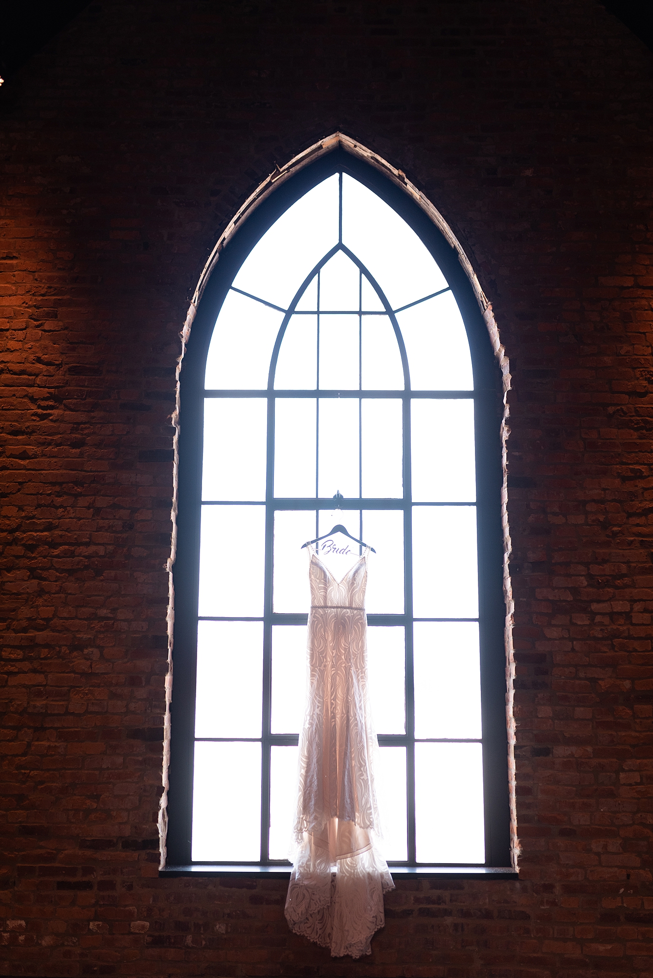 Wedding Dress Hanging on Window in Clementine Hall in Nashville, TN