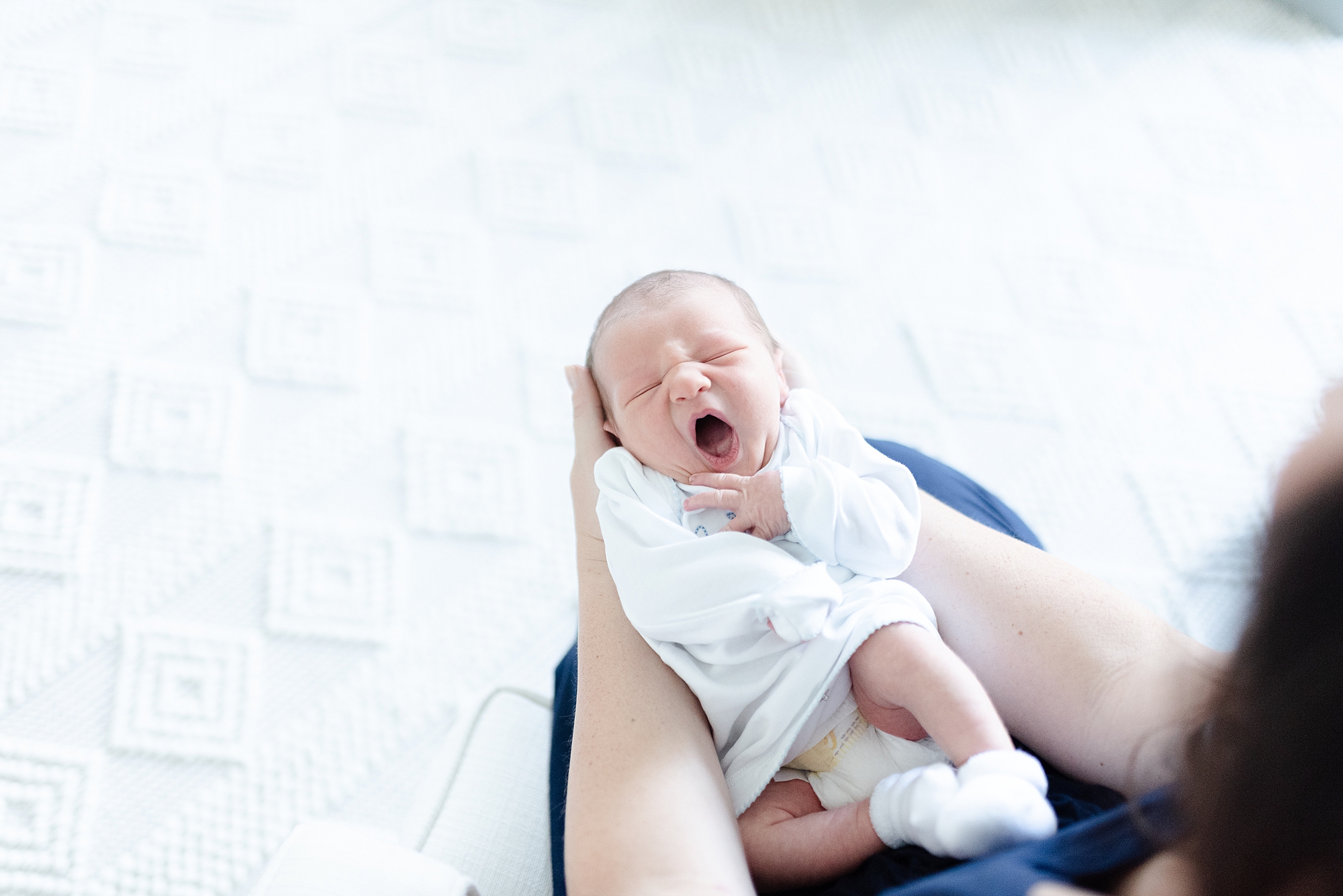 Baby Yawning in his nursery for portraits
