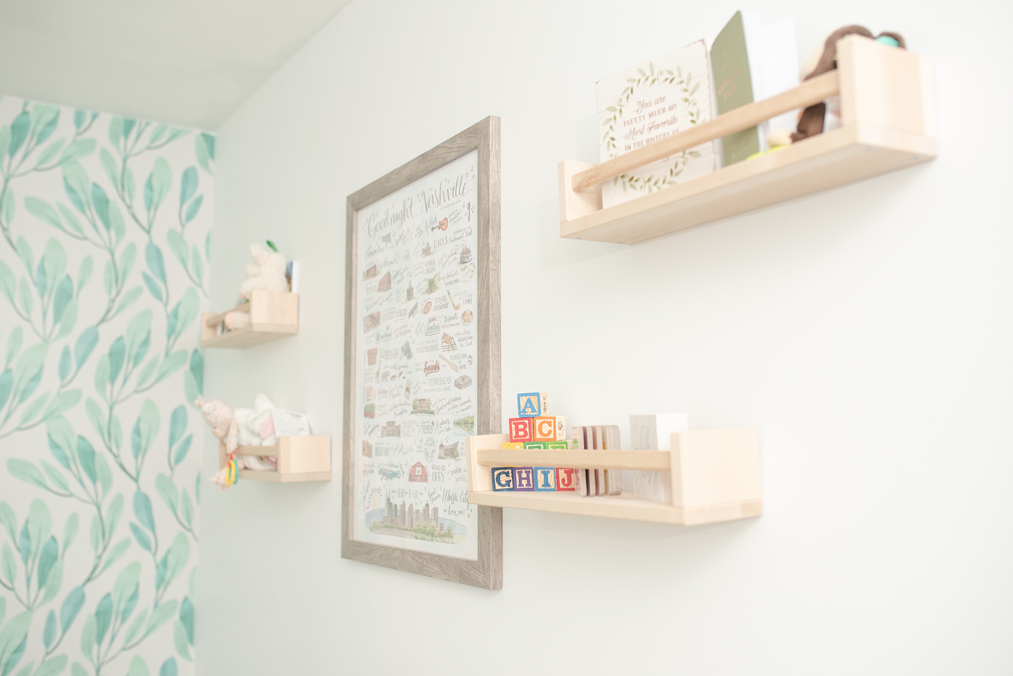 Modern Nursery Decor Details of a girls nursery in Nashville featuring a Music City Poster Print and four wooden shelves