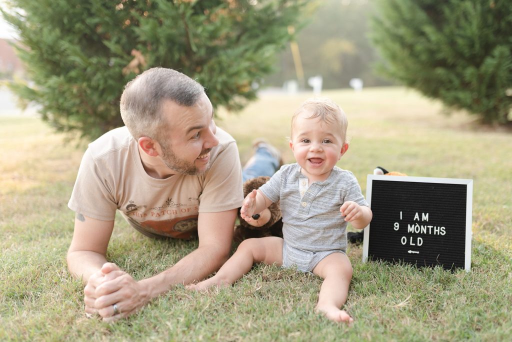 picture of a father and son on a sunny day for son's 9 month old milestone photos by nashville family photographer Dolly DeLong Photography