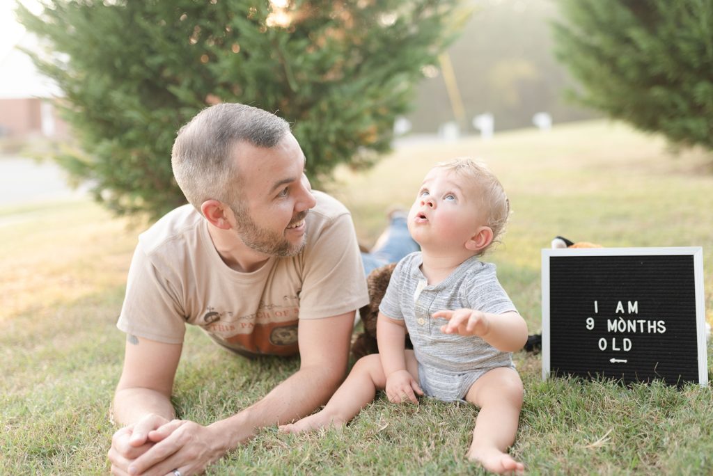 picture of a father and son on a sunny day for son's 9 month old milestone photos by nashville family photographer Dolly DeLong Photography
