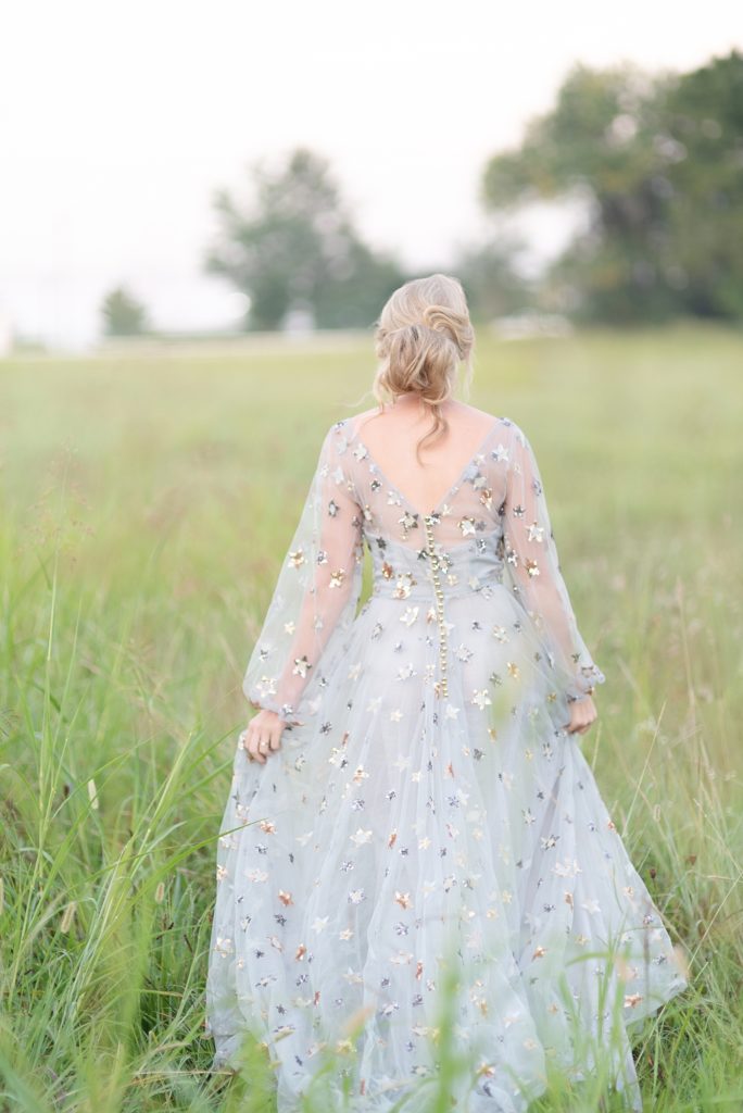 Caucasian woman wearing the stardust dress in the early morning of twilight before sunrise for a portrait session in Nashville by Dolly DeLong Photography