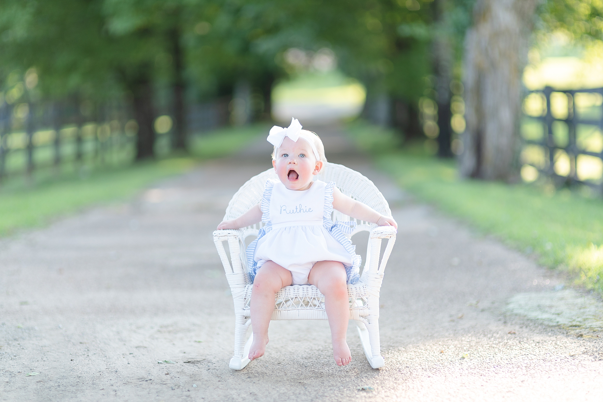 One Year Old Is Sitting On her Wicker Chair for her Portraits at Ravenswood Mansion