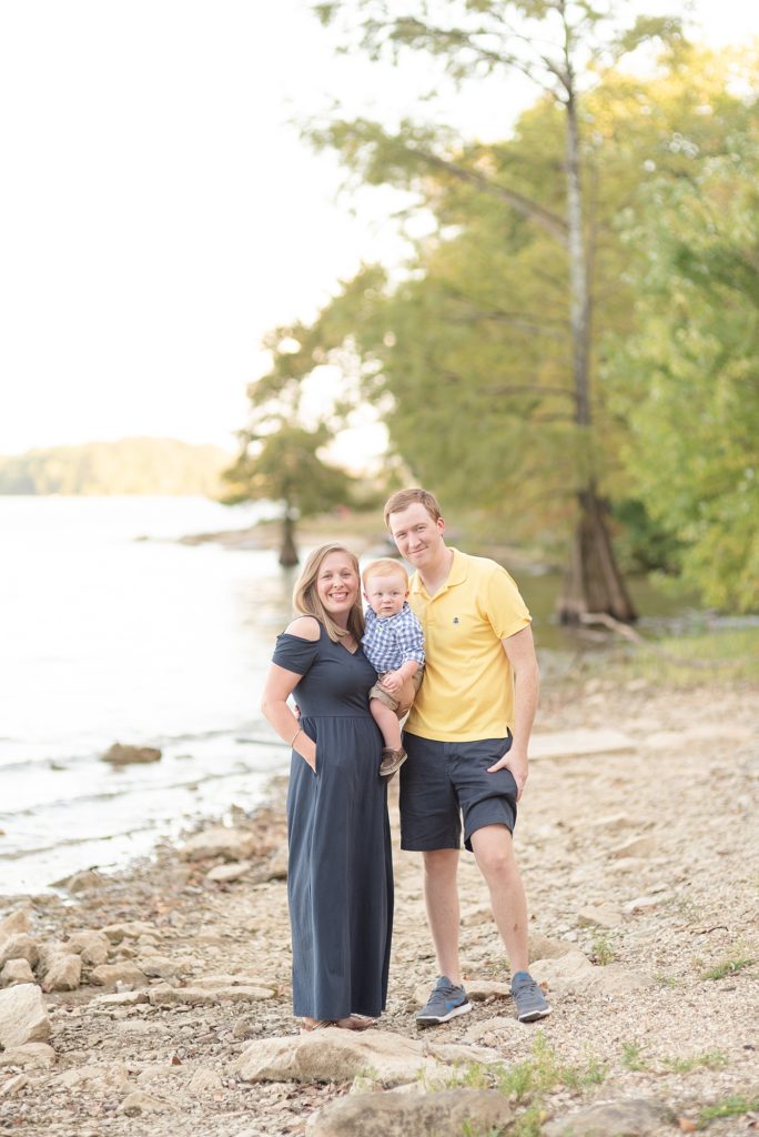 Family of Three Standing beside a lake in Nashville for family portraits by Dolly DeLong Photography Nashville and Montana Family Photographer