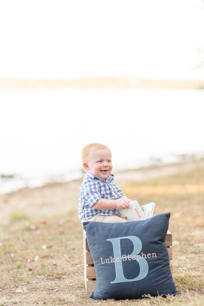 Baby Boy is celebrating his first birthday with portraits beside a lake in Nashville by Dolly DeLong Photography Nashville and Montana Family Photographer