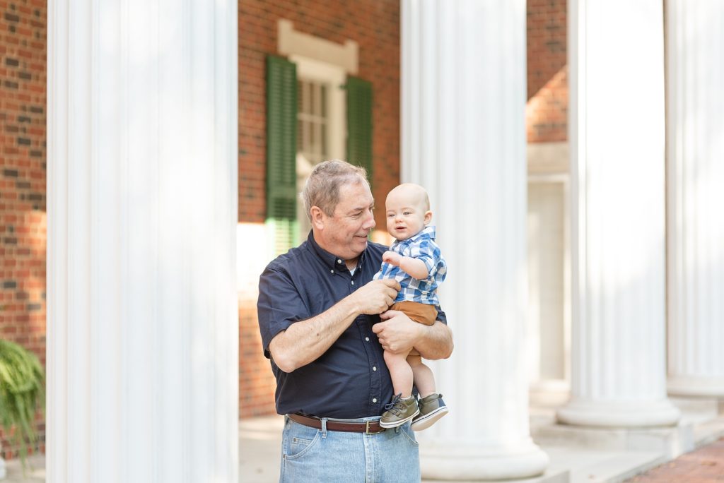 Grandparents are proudly holding their grandson for family portraits in Nashville