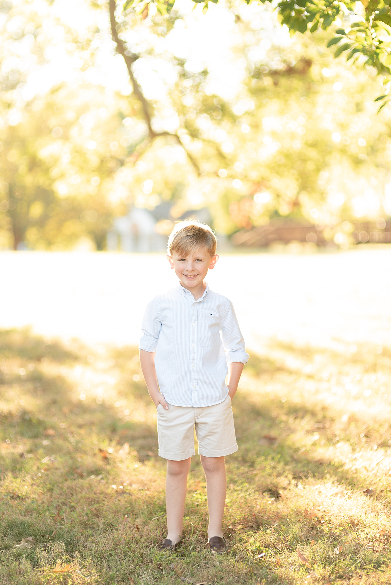 boy standing with golden hour type lighting around him at the Nashville Ellington Agricultural Center
