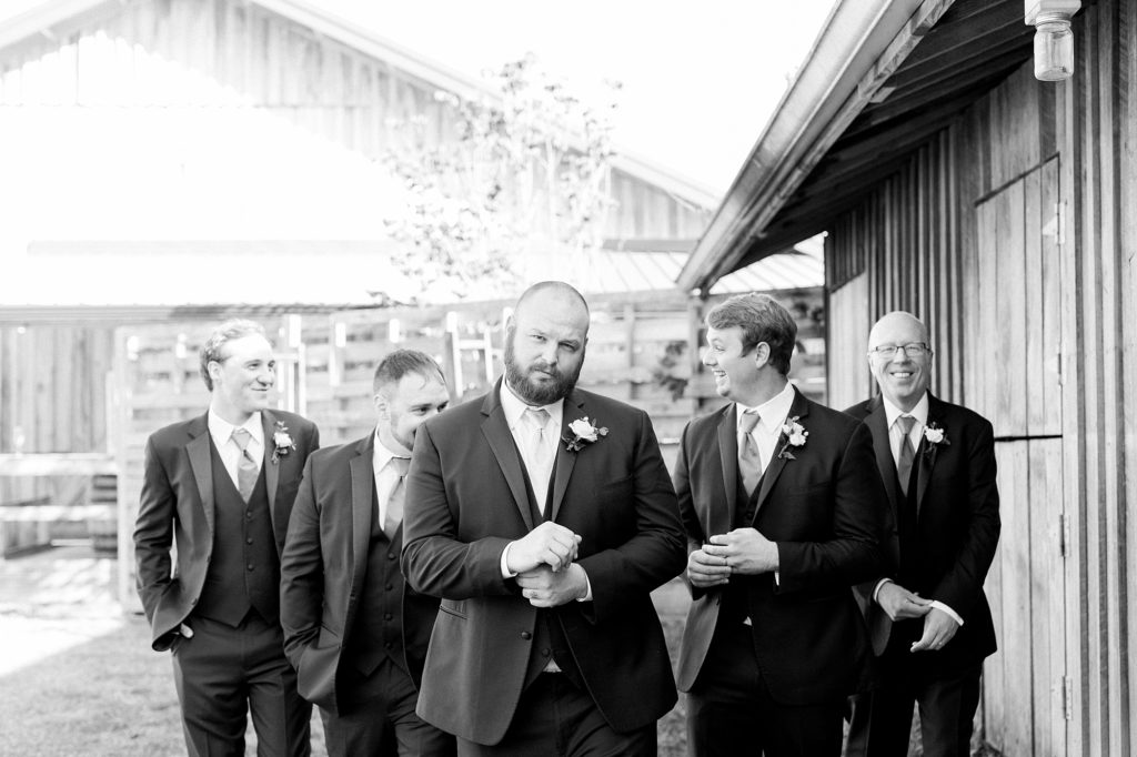 a black and white photo of grooms and groomsmen for a southern wedding