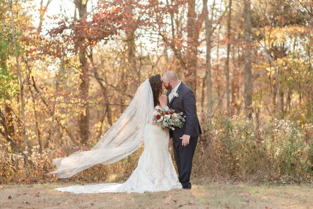 bride and groom kissing in the sunset in Nashville in Fall for husband and wife wedding portraits
