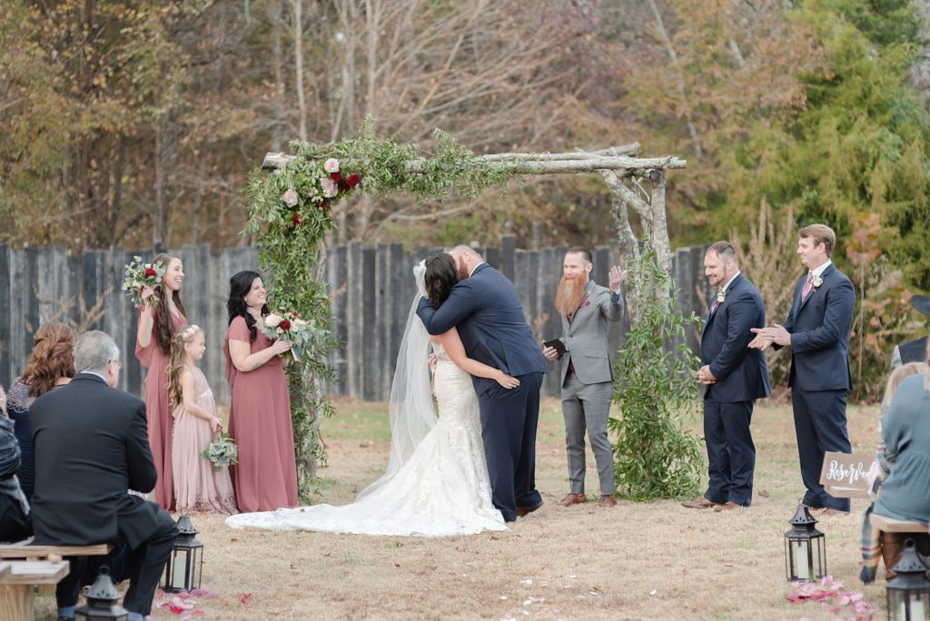 first kiss after exchanging vows on their wedding day at hidden creek farm weddings