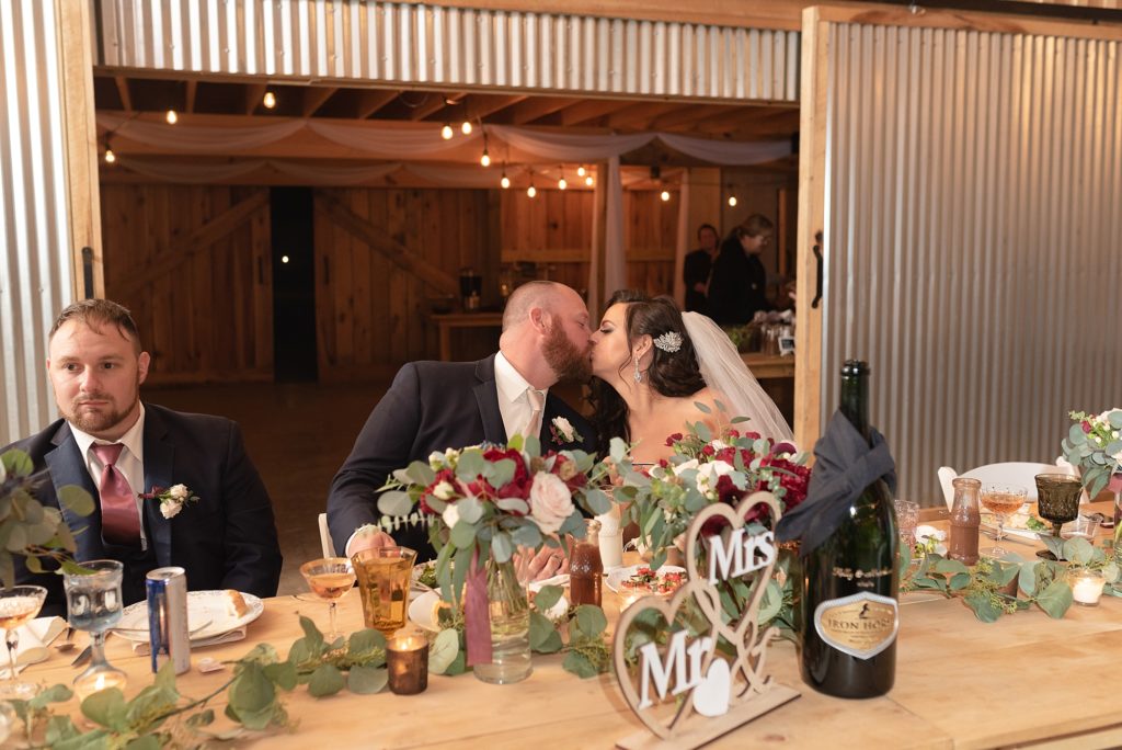 a bride and groom share a kiss at their reception in Nashville