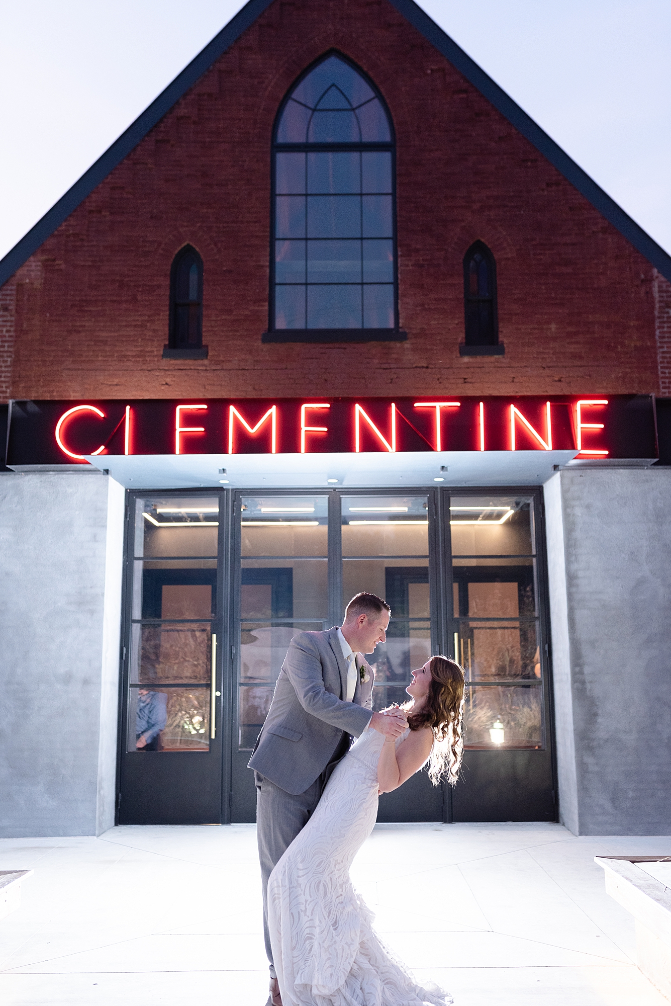 Bride and Groom Portraits in front of The Clementine for their Summer wedding by Dolly deLong Photography