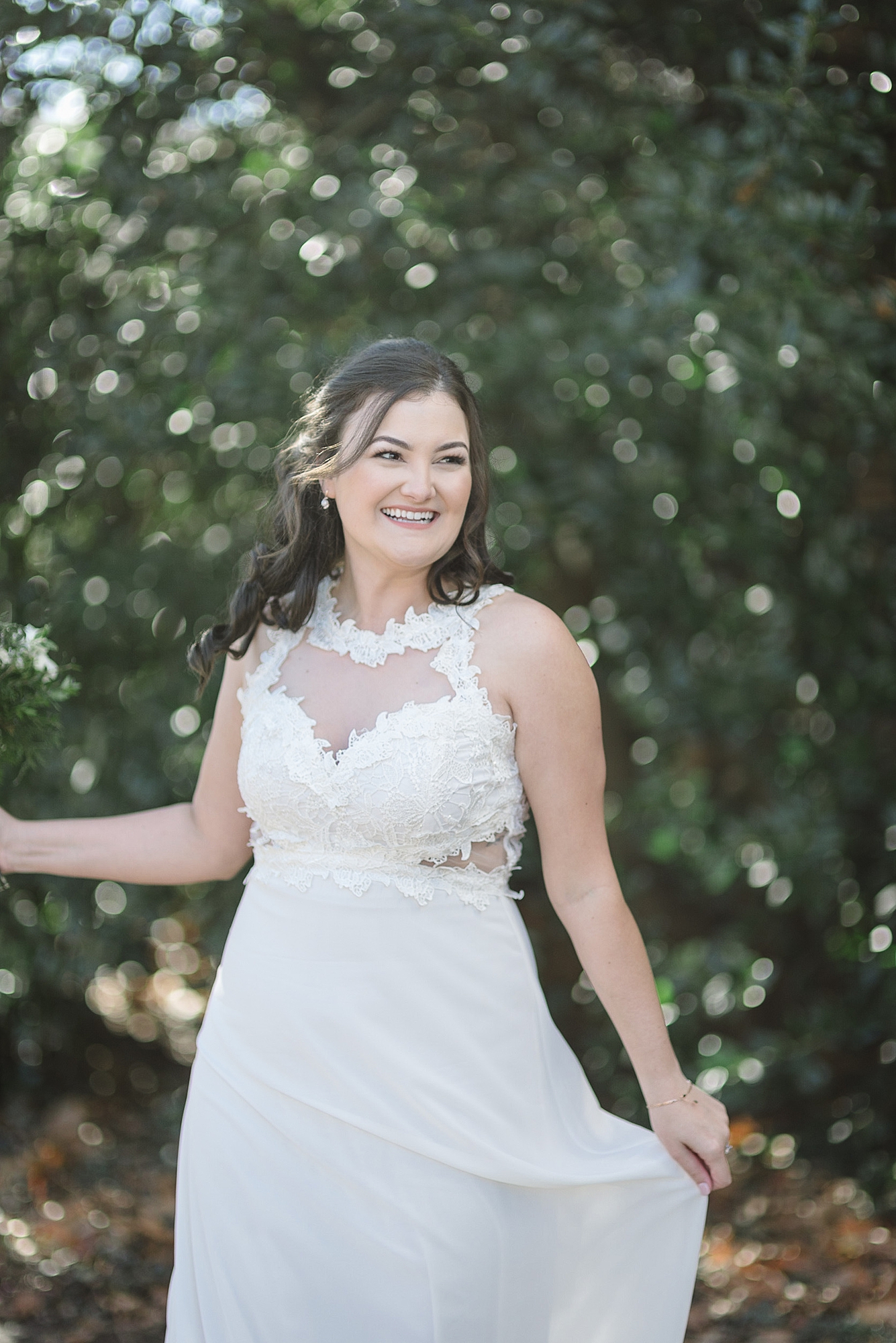 A bride is twirling around on her wedding day for her winter wedding in Murfreesboro Tennessee by Dolly DeLong Photography