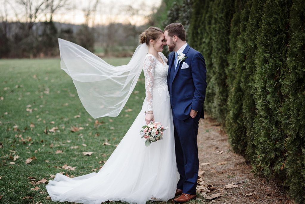 husband and wife portraits for their winter wedding at the barn at sycamore farms in Arrington Tennessee by Dolly DeLong Photography