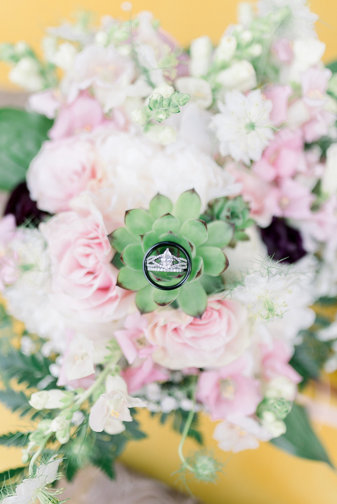 Wedding Day Details of a bridal bouquet and ring shot by Dolly DeLong Photography