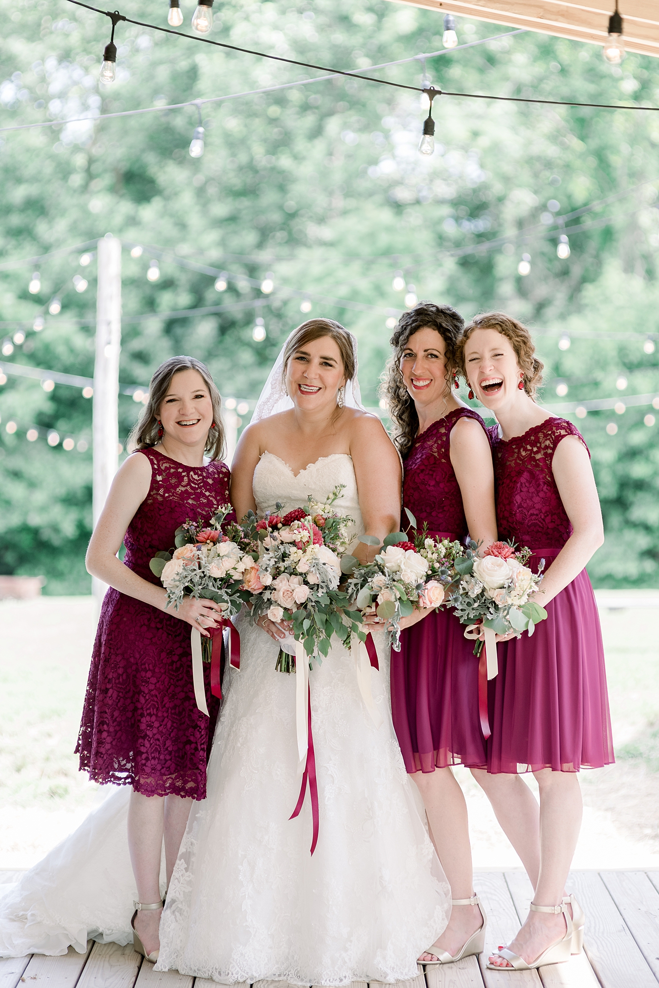 Bride with her Bridesmaids at HIdden Creek Farm Weddings for a Summer June Wedding by Dolly DeLong Photography