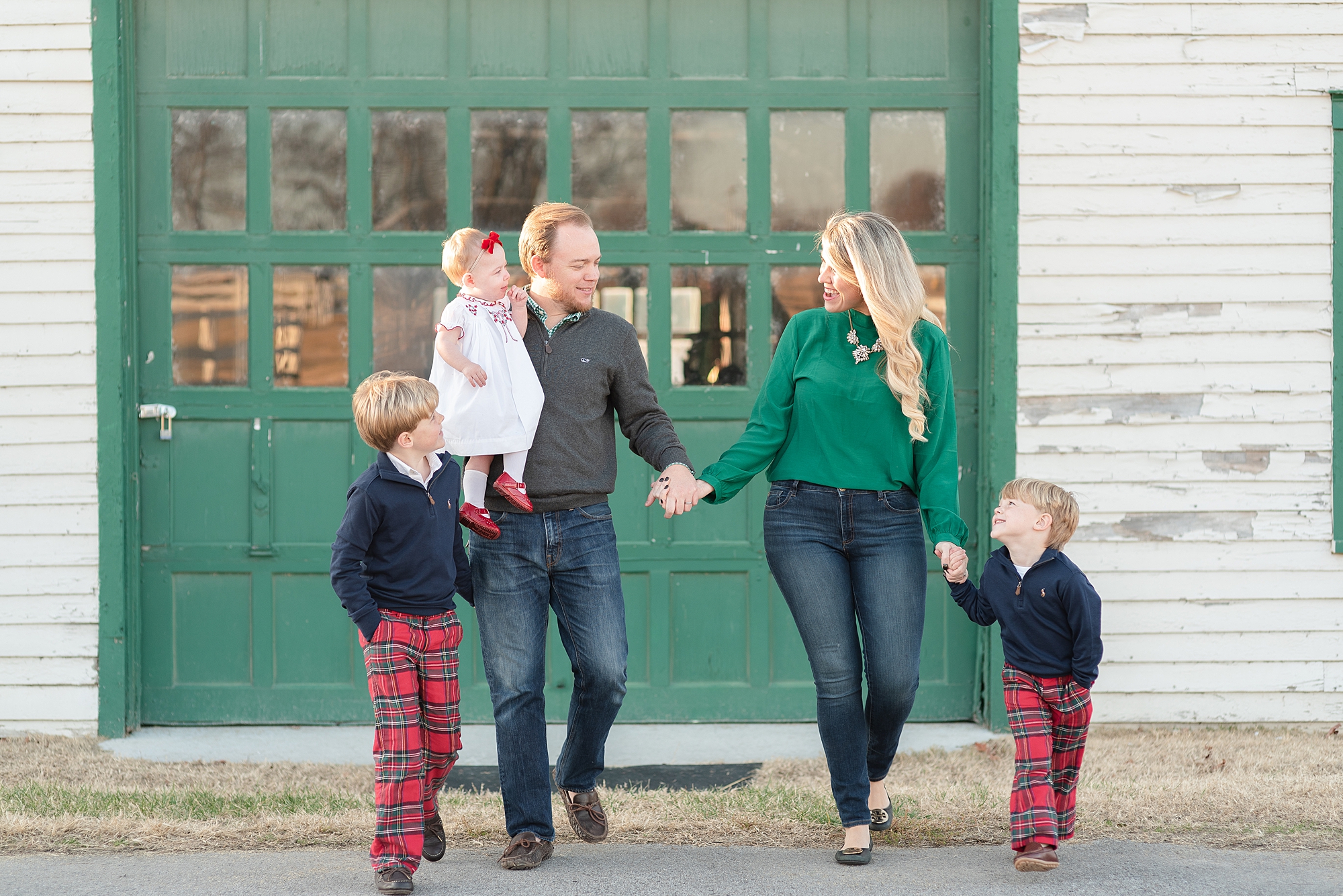 family of five holding hands at harlinsdale farm in franklin for family portraits