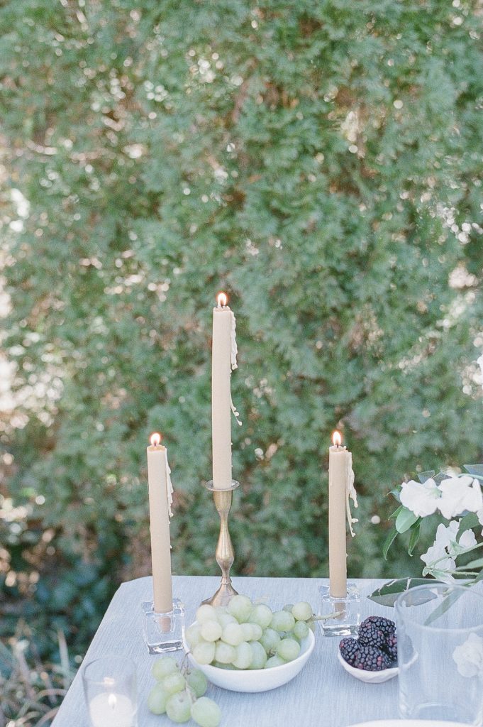 three candlesticks on a table