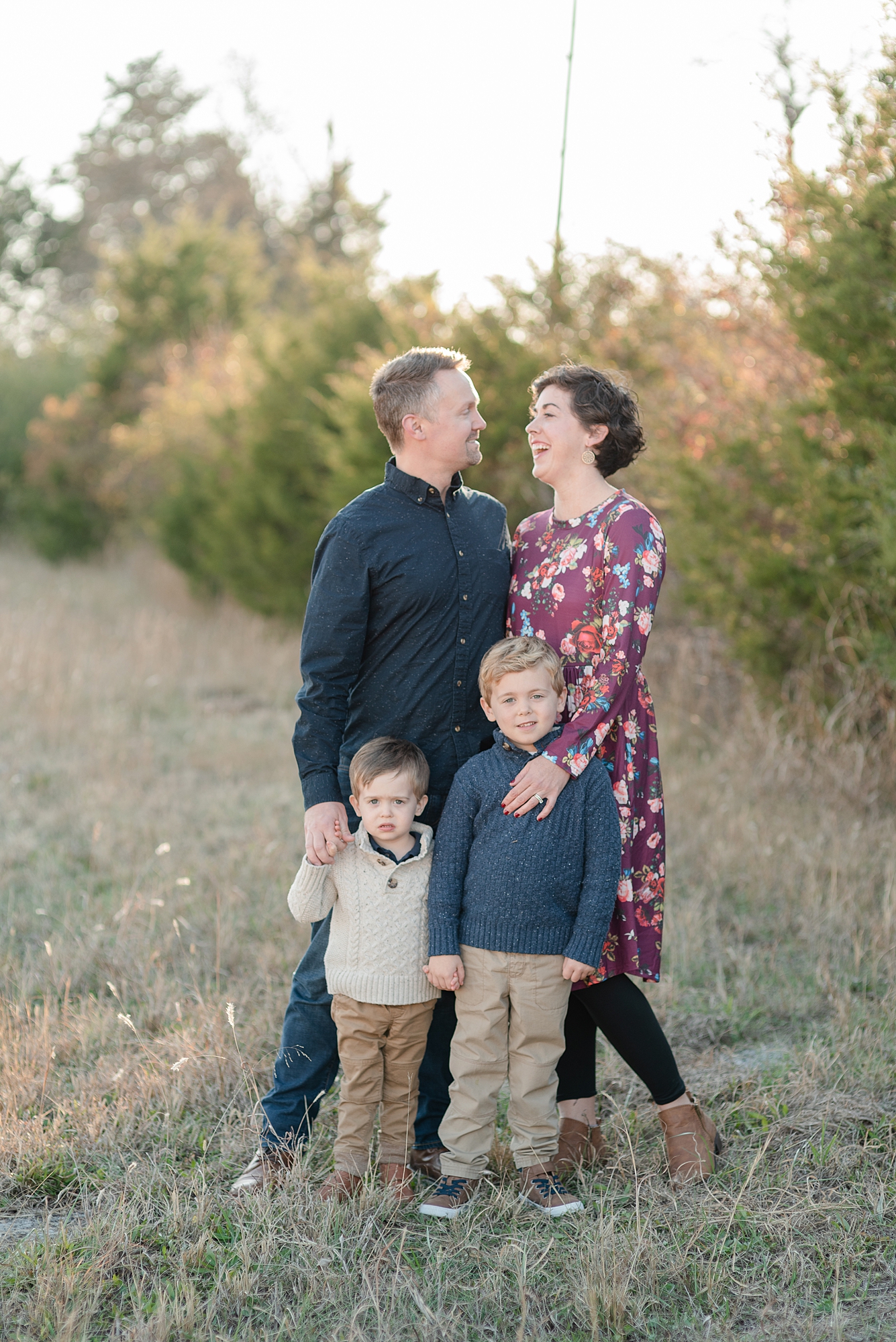 family of four two sons and mom and dad taking their family photos in Nashville by Nashville family photographer Dolly DeLong Photography