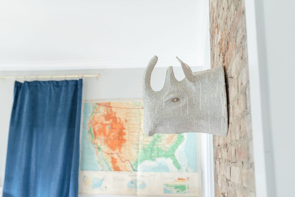 modern nursery decor ideas for a boys nursery by Nashville Newborn Photographer Dolly DeLong this nursery is very bright because it has a lot of natural light coming into the room and there is a us map on the wall