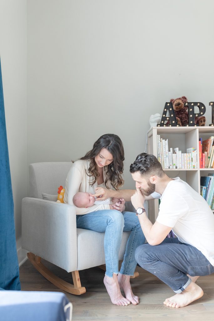 a bright and airy nashville newborn home photography session in East Nashville with Dolly DeLong Photography featuring a young couple and their sweet baby boy