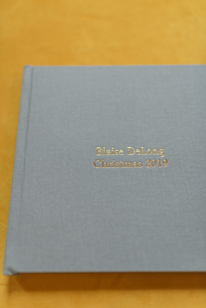image of a kiss books album by Dolly DeLong Photography