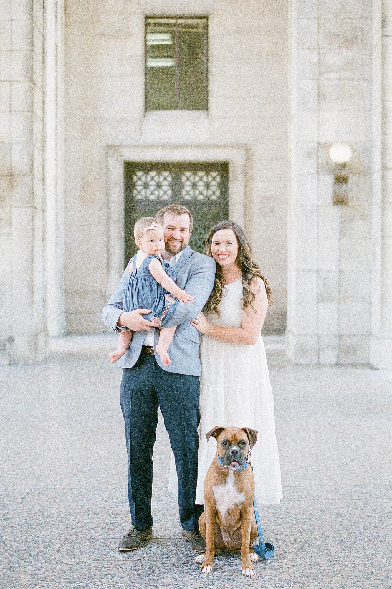 a husband and wife are celebrating their 4 year wedding anniversary with portraits on fuji400h film with Nashville engagement and family photographer Dolly DeLong Photographer at the War Memorial in Nashville