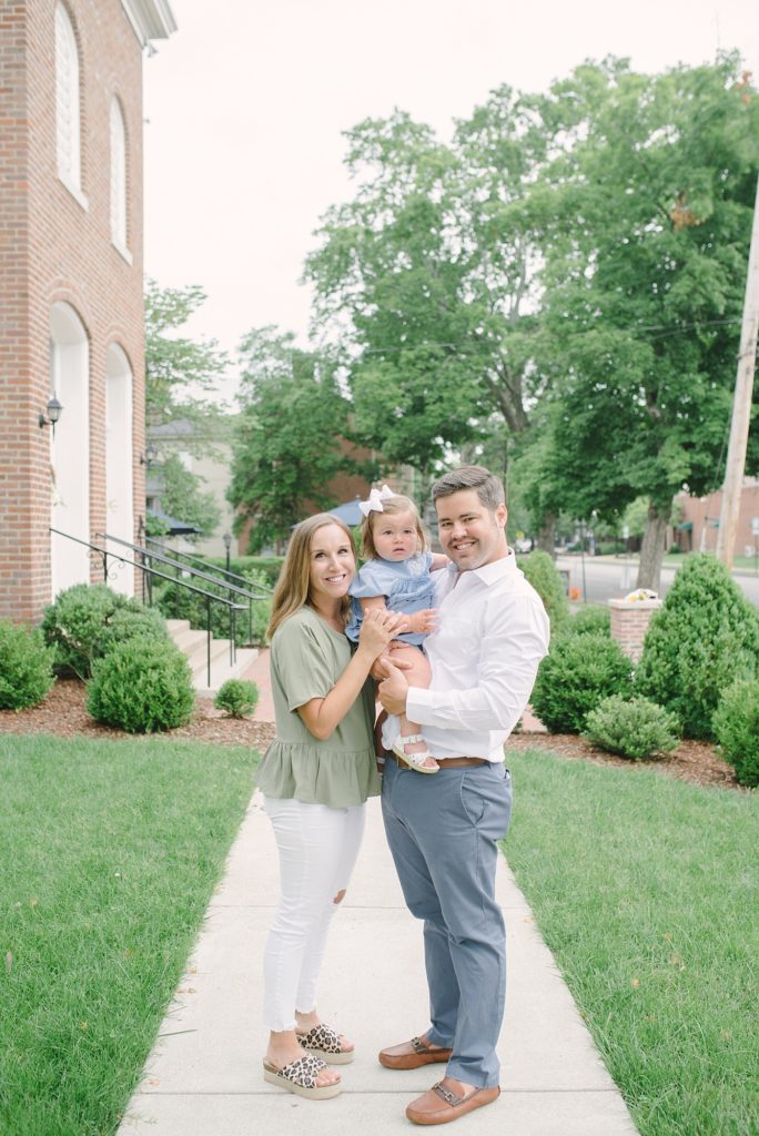 a_family_of_three_takes_their_family_photos_in_downtown_historic_franklin_with_nashville_family_photographer_Dolly_DeLong