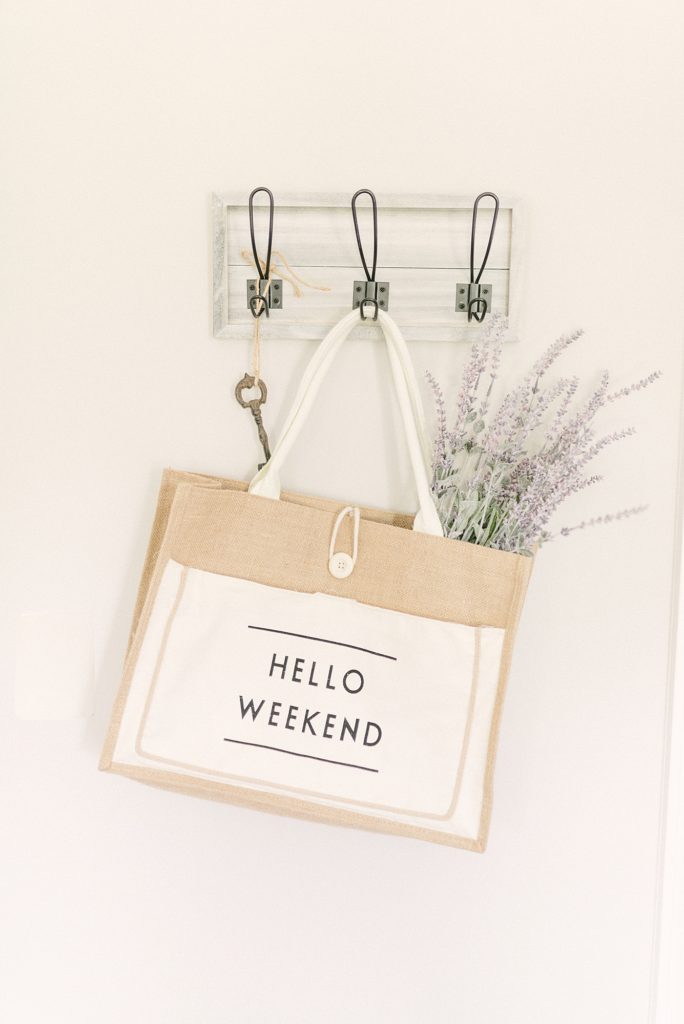 stock image of a hello weekend bag holding lavender flowers by Nashville Branding Photographer Dolly DeLong Photography