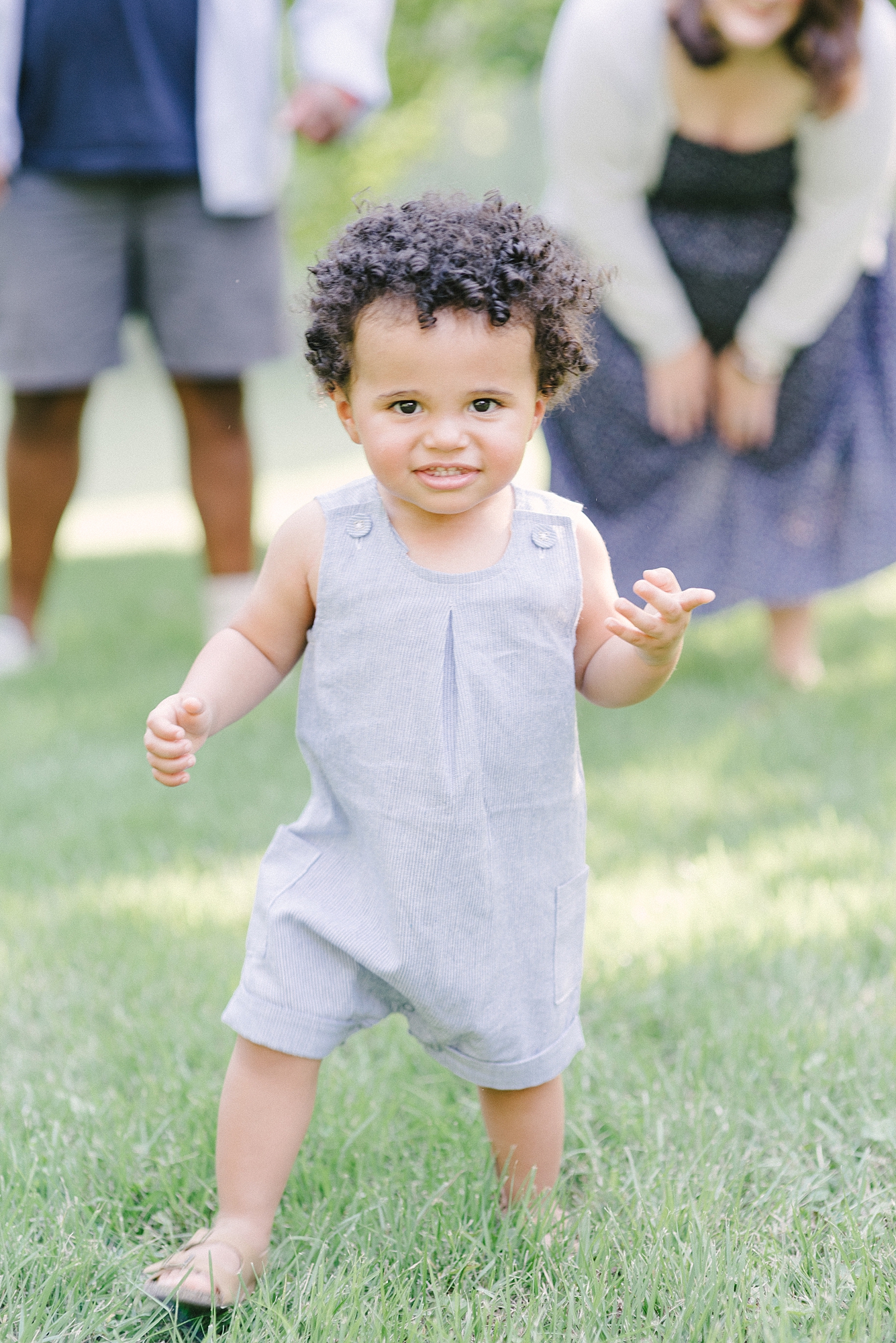 little boy running in the park at family photography session in Nashville with Nashville Family Photographer Dolly DeLong Photography