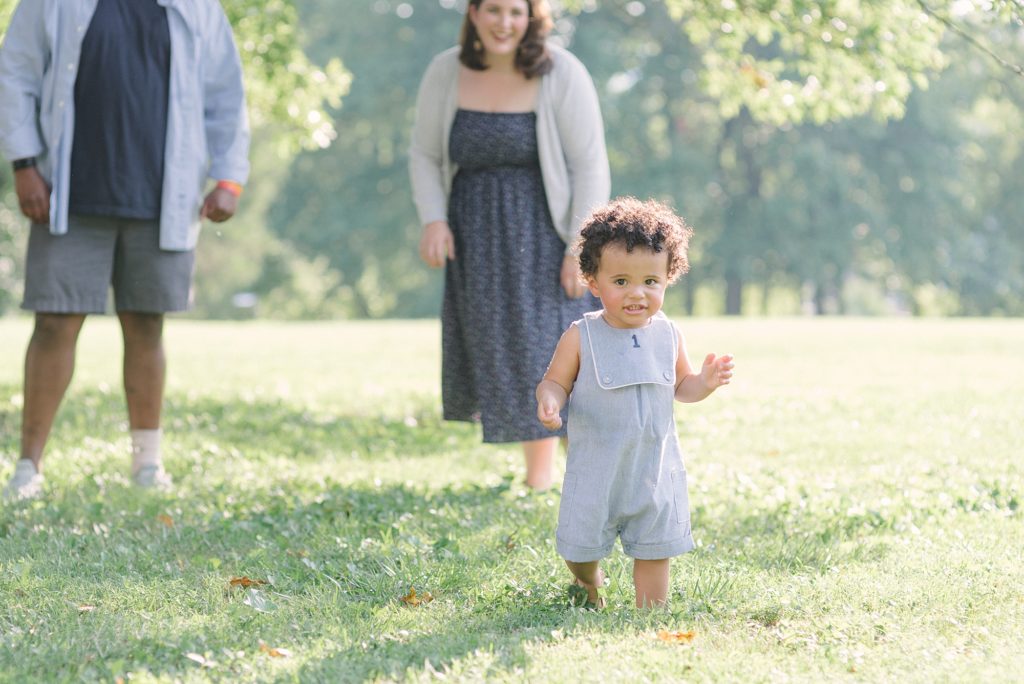 toddler boy walking in the park at the nashville agricultural center by nashville family photographer dolly delong