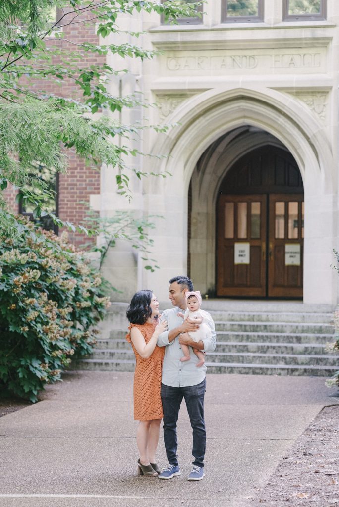 korean mom indian dad and their baby standing at Vanderbilt University for Family Photos with Dolly DeLong Photography