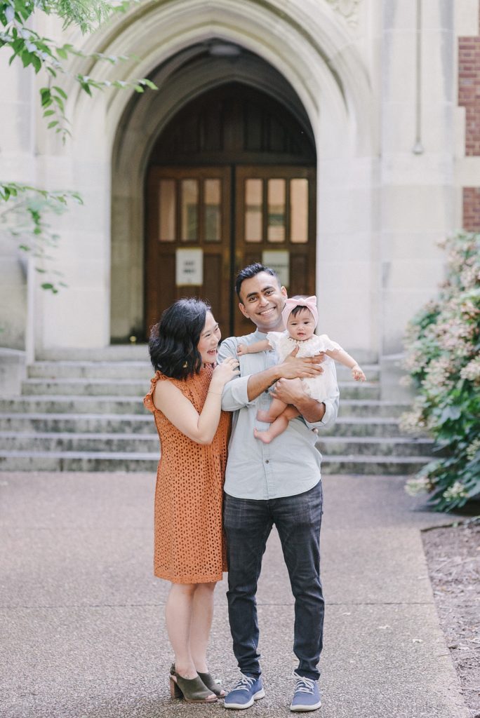 korean mom indian dad and their baby standing at Vanderbilt University for Family Photos with Nashville Family Photographer Dolly DeLong Photography