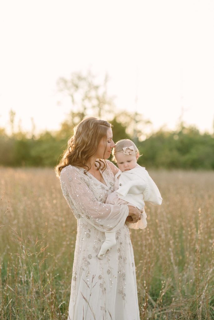 mother and daughter sunset portraits in a tall grassy field in Nashville, TN by Nashville Family Photographer Dolly DeLong