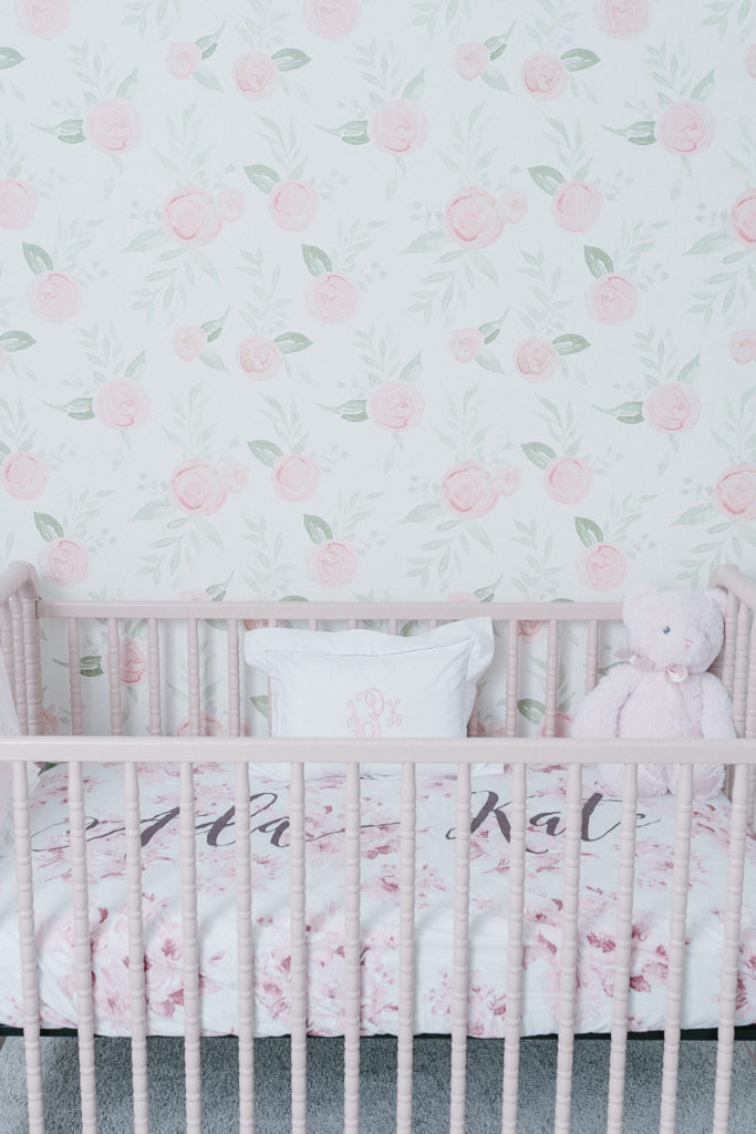 pink blush and white nursery with rose and flower print on walls nursery decor ideas and photos by Nashville Newborn Photographer Dolly DeLong Photography