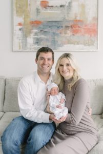 new parents hold baby girl during Nashville lifestyle newborn session