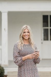 photographer works on phone during Nashville personal branding portraits