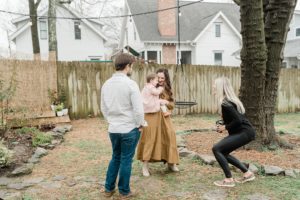 family photographer plays with toddler during session in Nashville