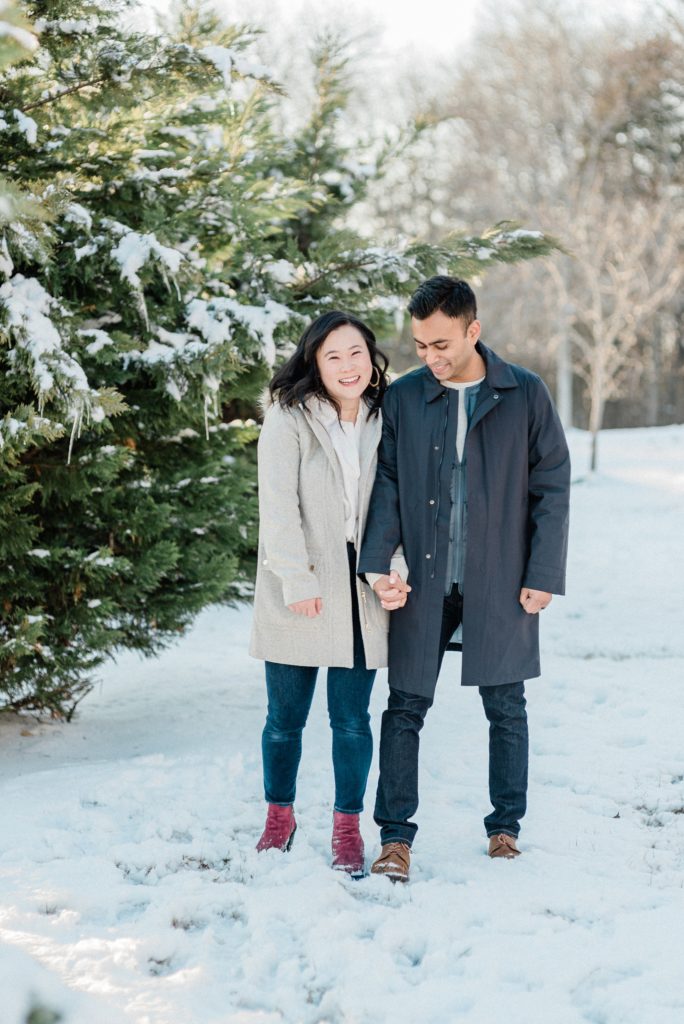 couple walks through snow in Nashville