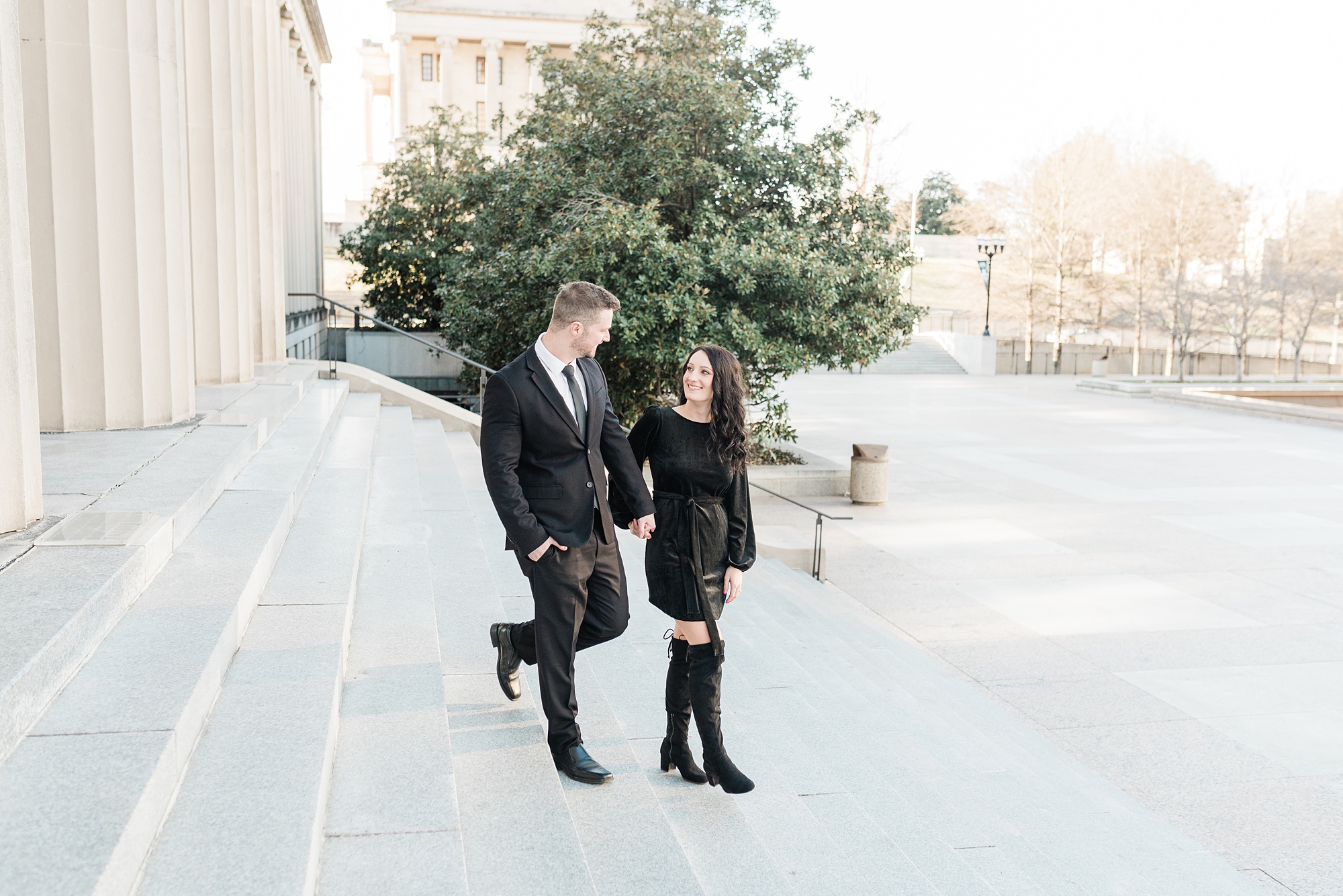 engaged couple walks down steps on Nashville's War Memorial