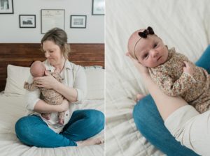 mom holds new baby girl on bed
