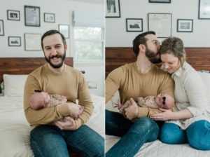 dad holds newborn baby and kisses wife