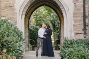 husband kisses wife's forehead during Vanderbilt University maternity session