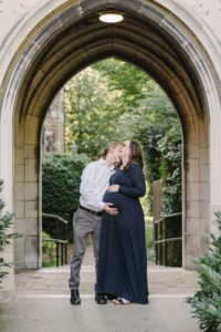 husband kisses wife's neck during fall Nashville maternity photos