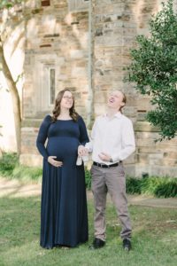 husband laughs with wife during Vanderbilt University maternity session