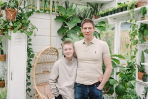 dad poses with son during Nashville greenhouse