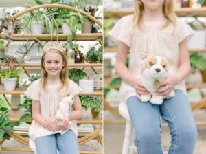 young girl holds puppy dog during East Nashville Greenhouse mini sessions