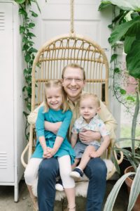 dad hugs toddlers in lap during TN family photos